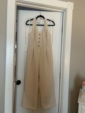 Sleeveless Cream Wide-Leg Jumpsuit with Button Front and halter top